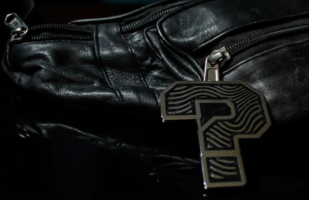 ZipDrip Zipper Pull on a black leather jacket zipper